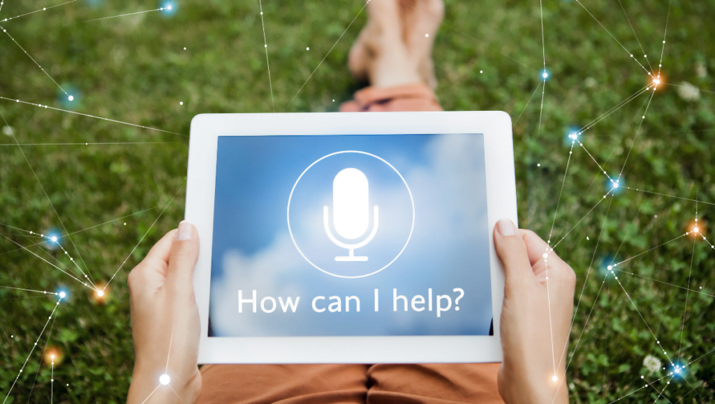 A woman holds a tablet on her lap that says “How can I help?” Learning how to delegate virtual assistant duties will help you get back to running your shit and growing your business.